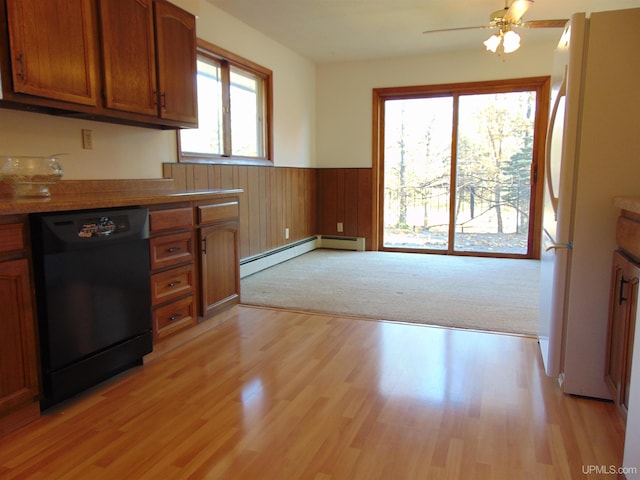 kitchen with ceiling fan, light wood-type flooring, dishwasher, white fridge, and baseboard heating