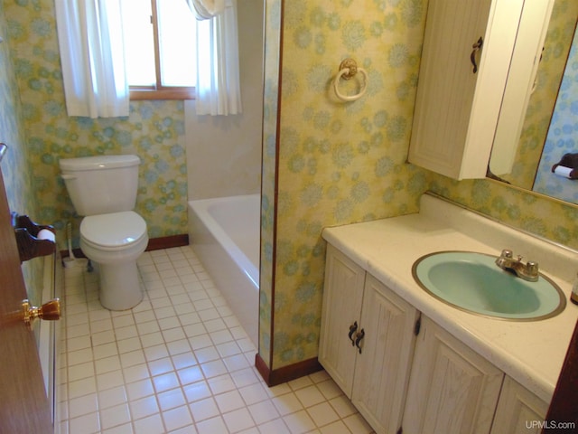 bathroom featuring vanity, toilet, and tile patterned floors