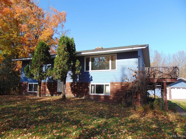 view of front of property with a front lawn and a garage