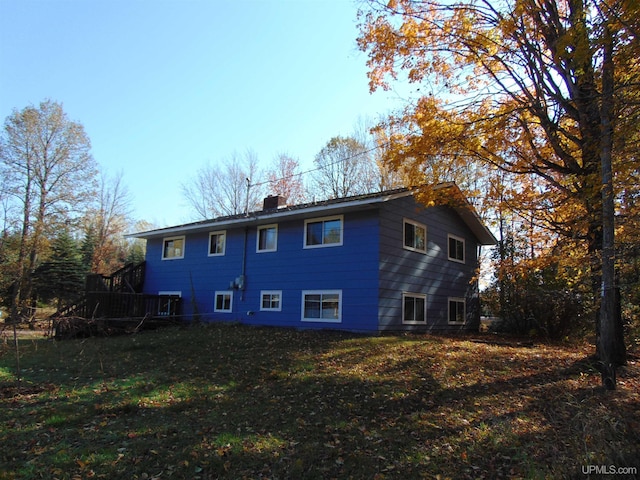 rear view of house with a lawn