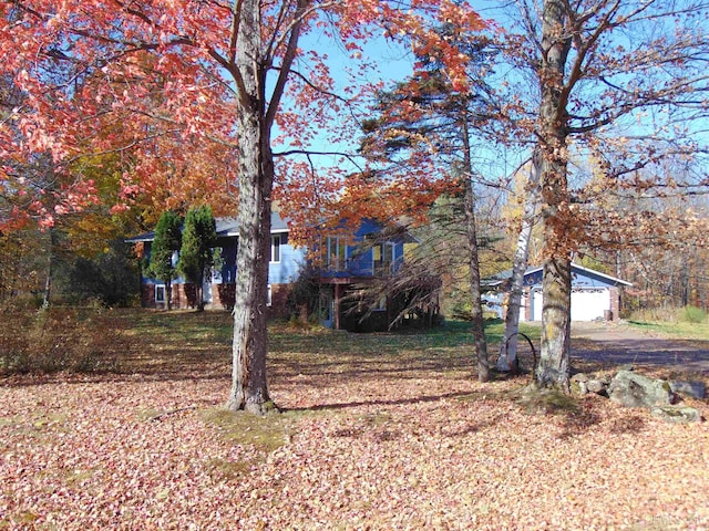 view of front facade with a garage and an outdoor structure