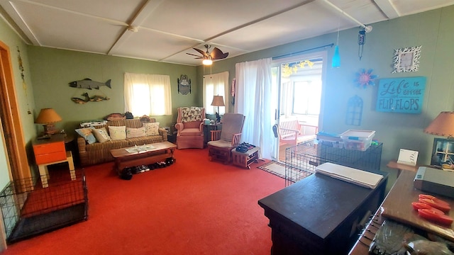 living room featuring carpet and ceiling fan