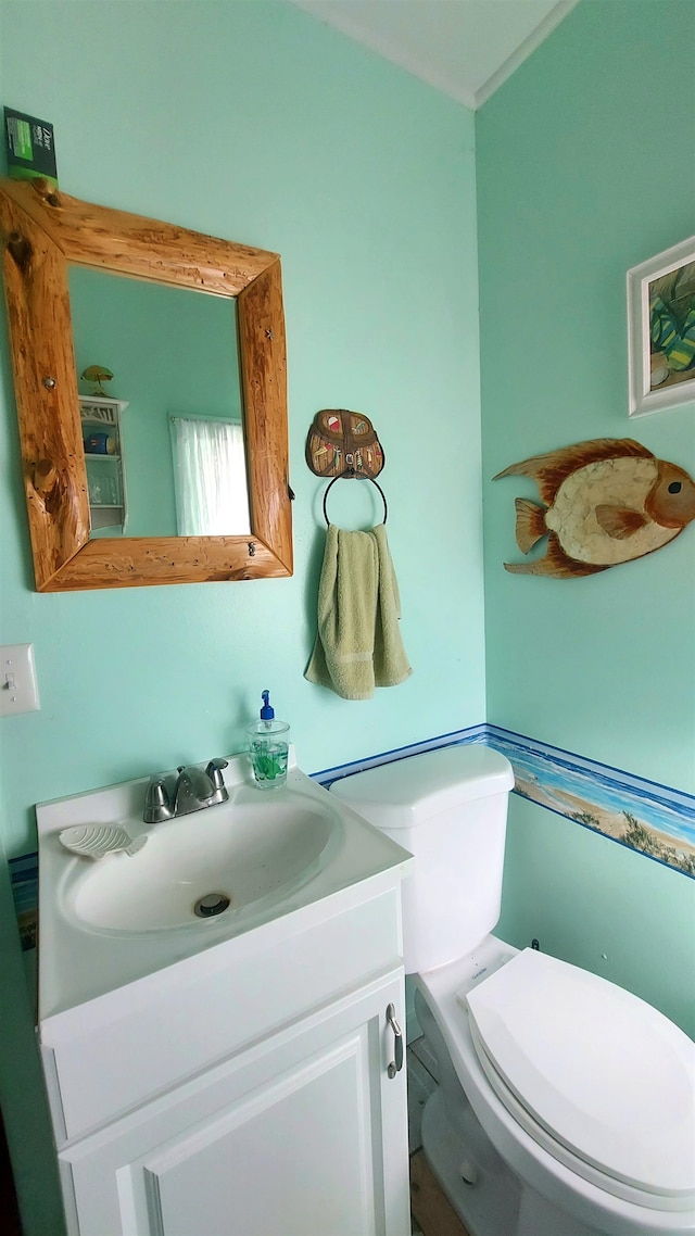 bathroom featuring vanity and toilet