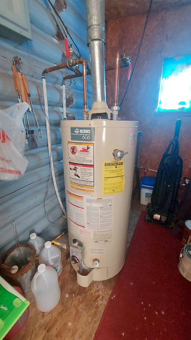 utility room featuring gas water heater