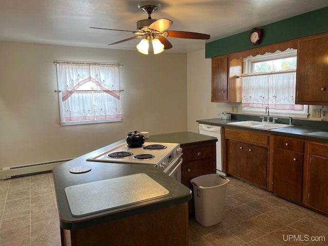 kitchen with white appliances, a baseboard radiator, sink, a kitchen island, and ceiling fan