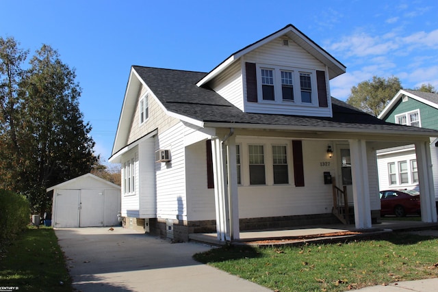 view of front facade featuring a storage unit and covered porch