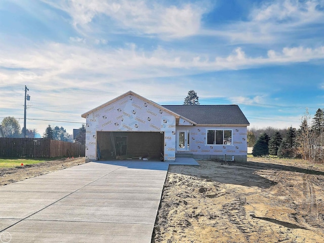 unfinished property with a garage