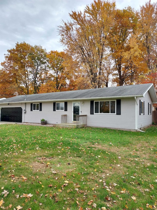 ranch-style house with a front yard and a garage