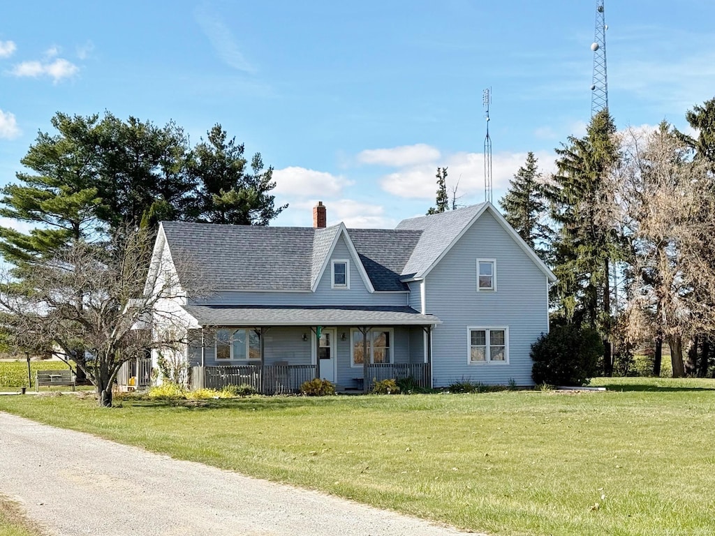 view of front of home featuring a front yard and a porch