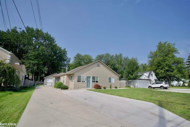 view of front of property with a front lawn and a garage