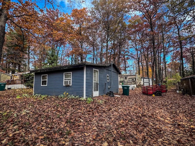 view of home's exterior with a storage shed