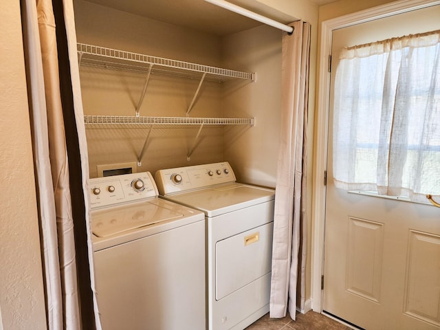 laundry room featuring separate washer and dryer