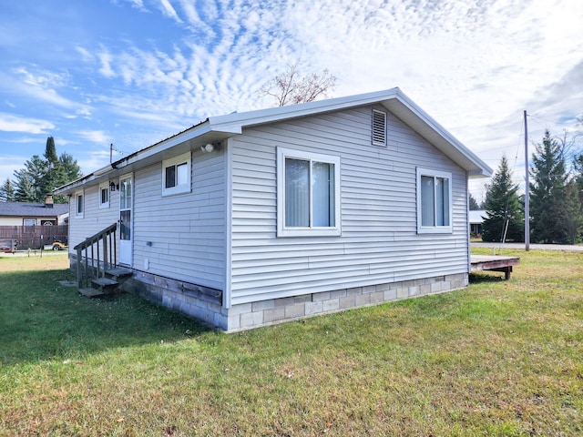 view of home's exterior featuring a yard