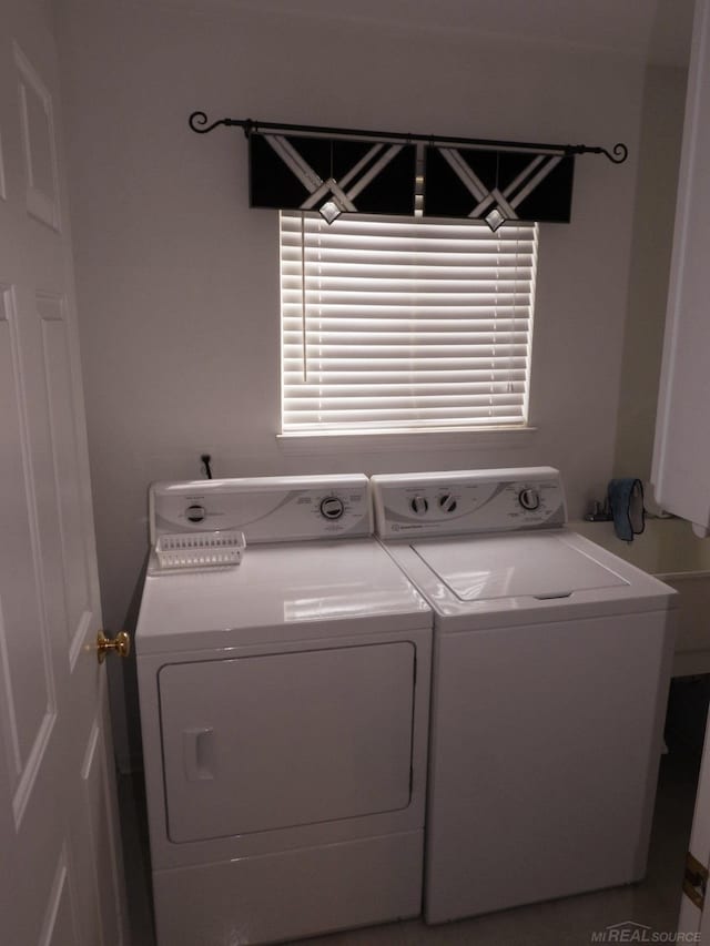 laundry area with washing machine and clothes dryer