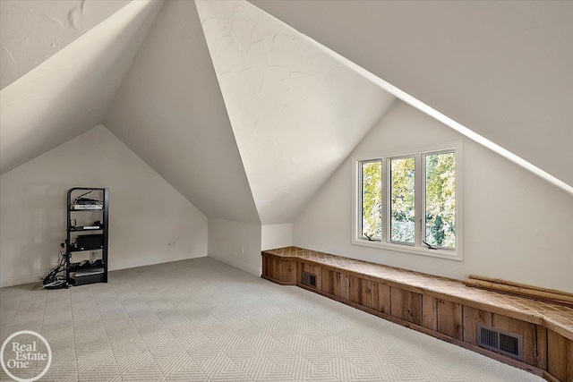 17680 E Jefferson Ave, Grosse Pointe, MI 48230 - additional living space featuring light colored carpet and vaulted ceiling