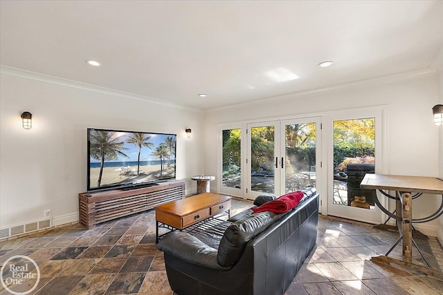 living room featuring crown molding and french doors