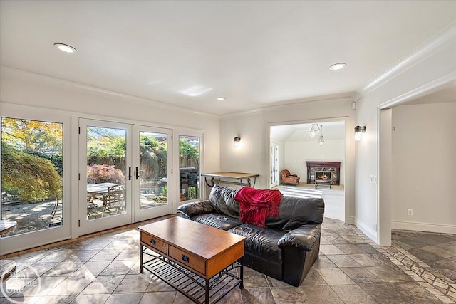 living room with crown molding and french doors