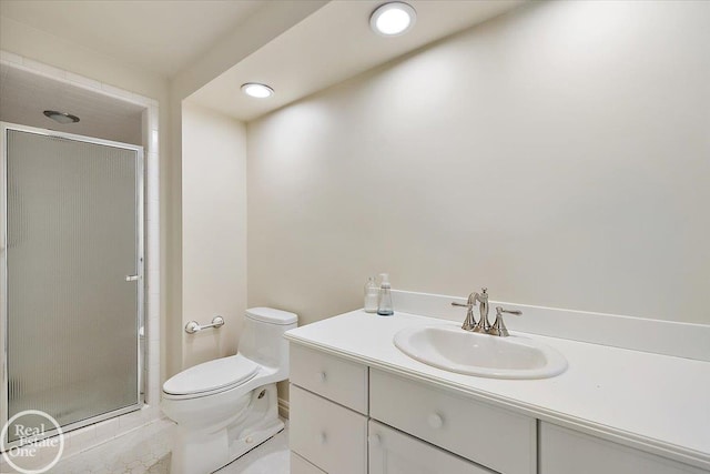 bathroom with toilet, tile patterned floors, walk in shower, and vanity