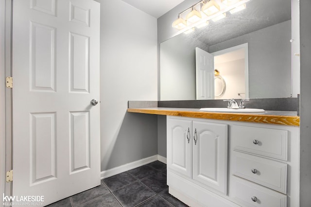 bathroom with vanity and tile patterned floors