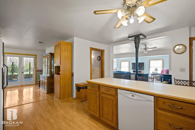 kitchen featuring light hardwood / wood-style floors, a healthy amount of sunlight, white dishwasher, and ceiling fan