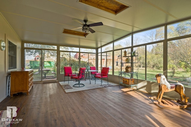 sunroom / solarium with lofted ceiling and ceiling fan