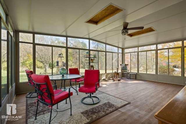 sunroom featuring ceiling fan