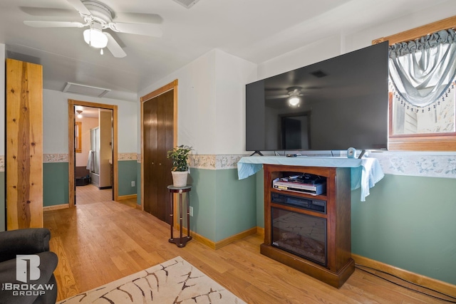 interior space with hardwood / wood-style floors and ceiling fan