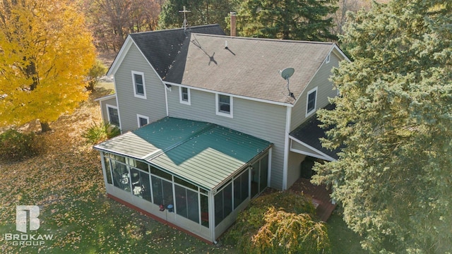 back of house with a sunroom