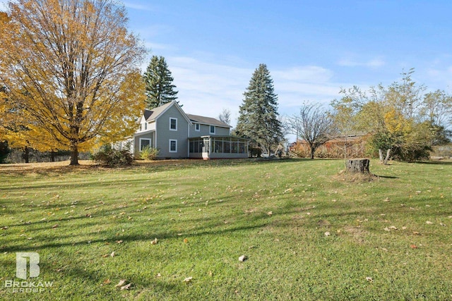 view of yard with a sunroom