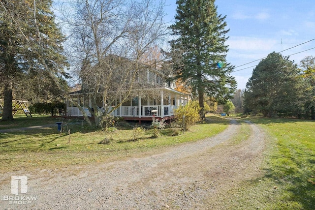 farmhouse inspired home with a porch and a front yard