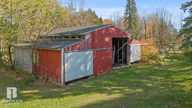 view of outdoor structure with a lawn