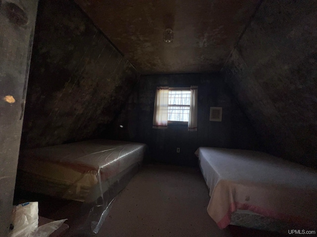 bedroom featuring lofted ceiling