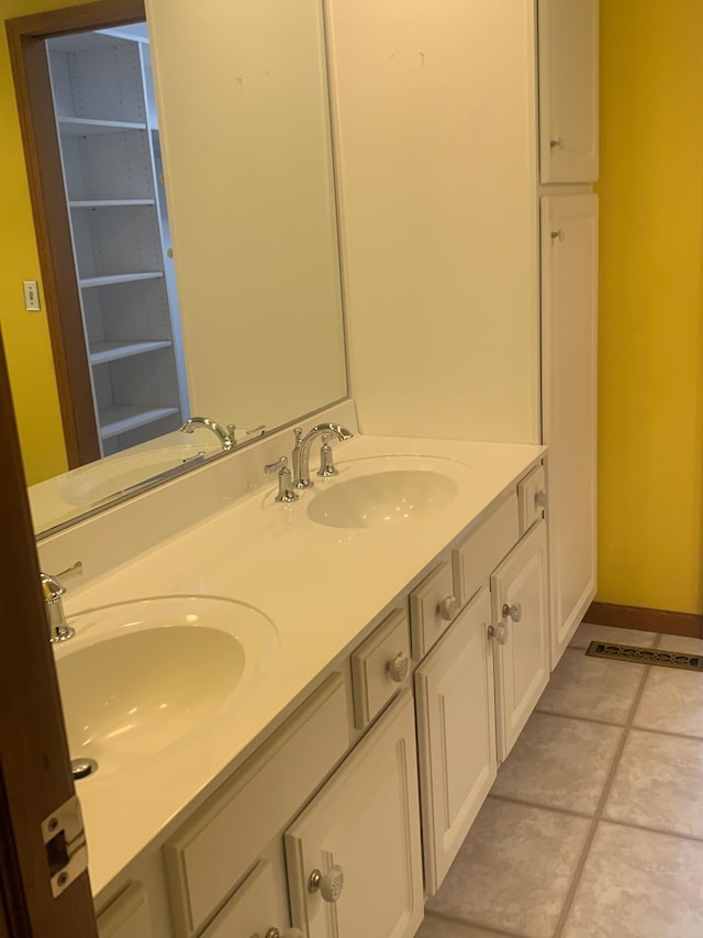 bathroom with vanity and tile patterned floors