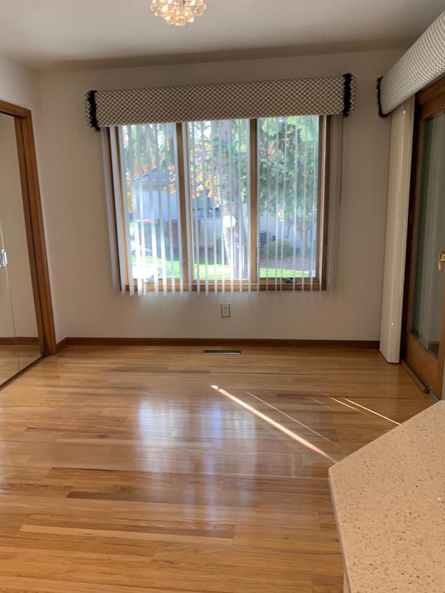 unfurnished bedroom with hardwood / wood-style flooring