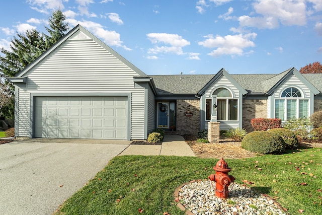 ranch-style house with a garage and a front yard