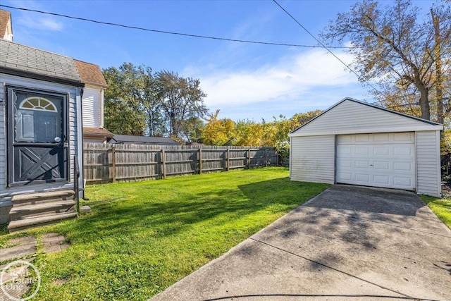 view of yard featuring an outbuilding and a garage