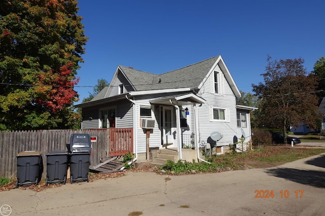 bungalow-style house featuring cooling unit and covered porch