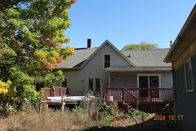 rear view of property with a deck