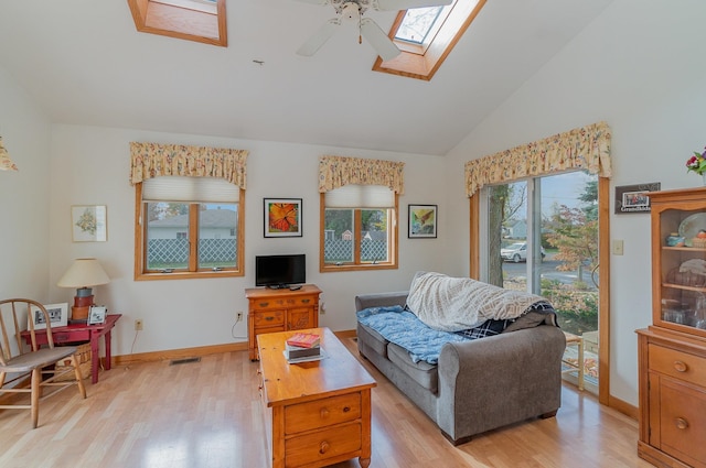 living room featuring light hardwood / wood-style flooring, plenty of natural light, and ceiling fan