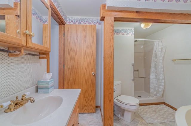 bathroom with tile patterned floors, vanity, curtained shower, and toilet