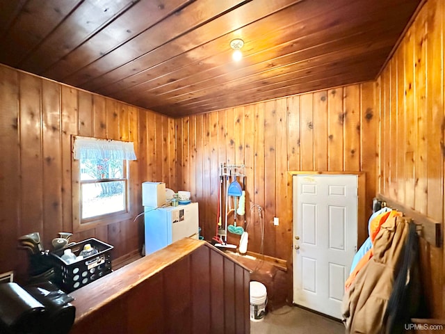 interior space featuring wood walls and wood ceiling