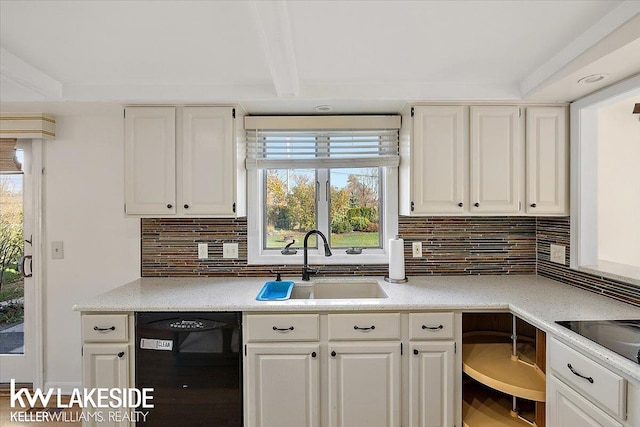 kitchen with black appliances, sink, tasteful backsplash, beamed ceiling, and white cabinetry