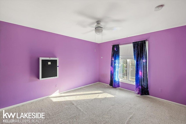 unfurnished room with light carpet and ceiling fan