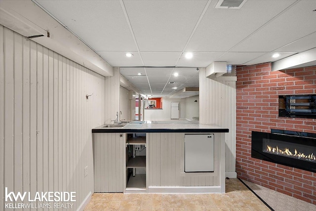 kitchen with wood walls and sink