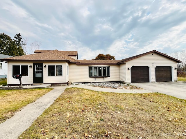 ranch-style house with a front yard and a garage