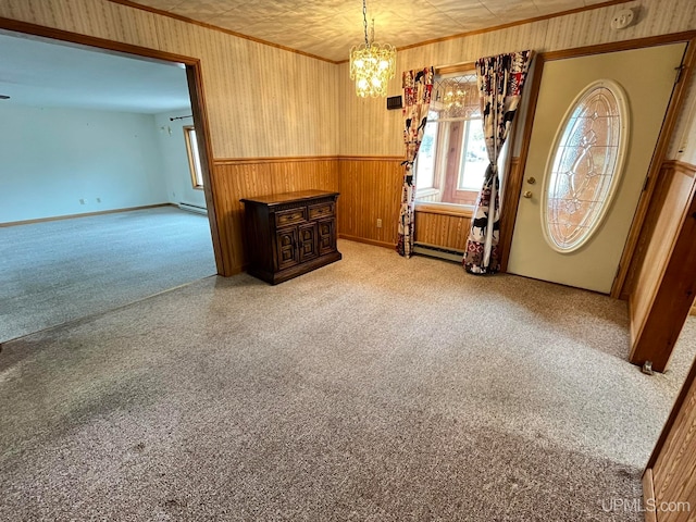 entrance foyer featuring baseboard heating and wooden walls