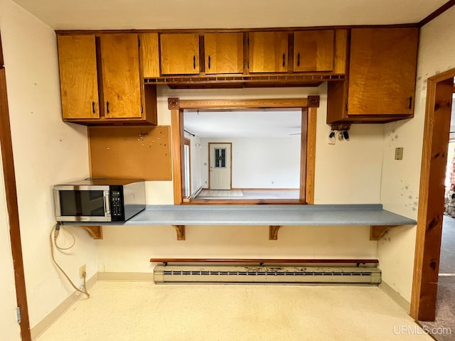 kitchen featuring baseboard heating