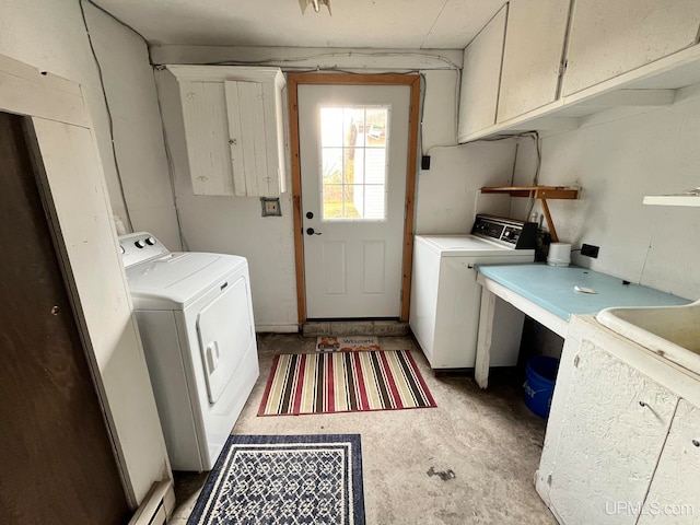 laundry area featuring cabinets and separate washer and dryer