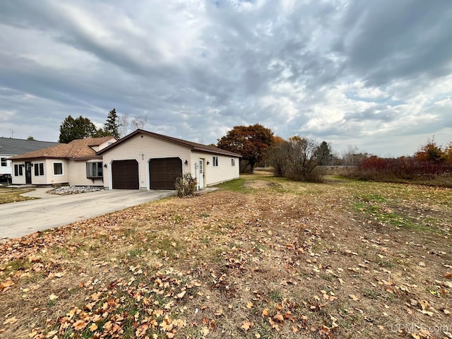 view of side of property featuring a garage