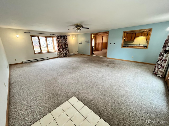 unfurnished living room with a baseboard radiator, light colored carpet, and ceiling fan